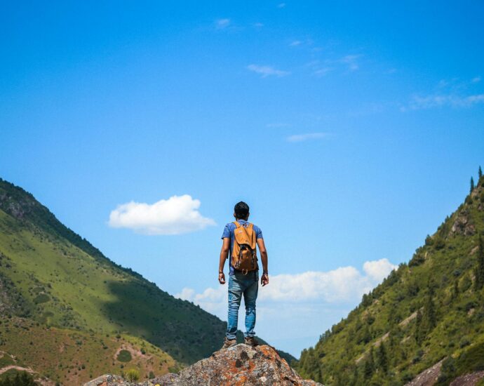 man on top of mountain