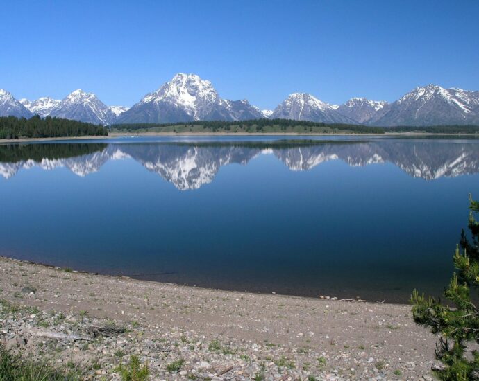 body of water under blue sky